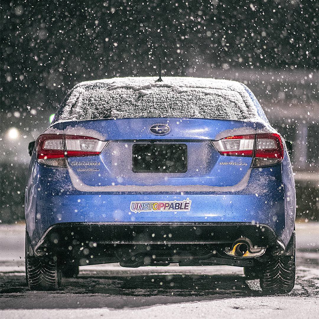 Wide bumper sticker version of the graphic on a car in a snowstorm